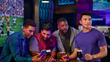 Guys on phones at a sports book