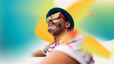 Guy smiling with citrus colors around him