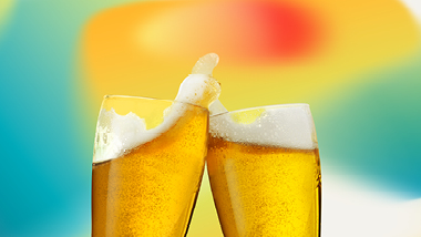 2 beers cheersing with citrus colors
