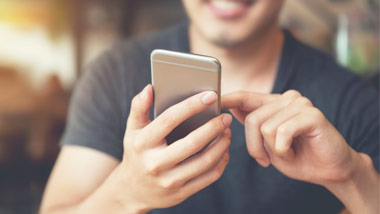 man playing on phone